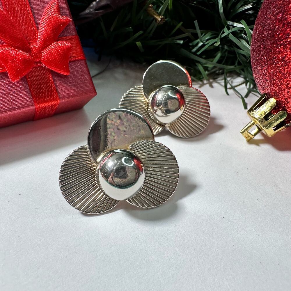 Silver flower clip on earrings